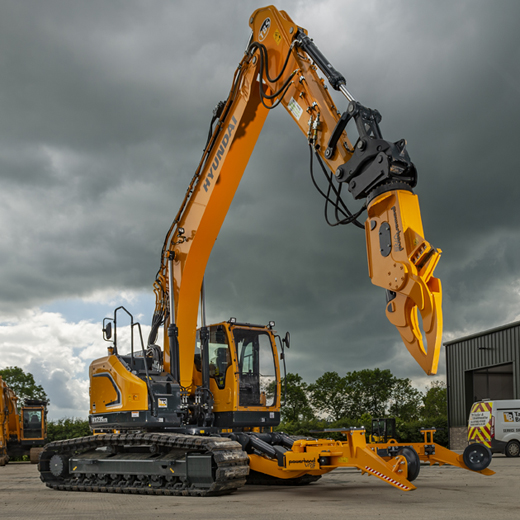 Hyundai excavator with powerhand attachment